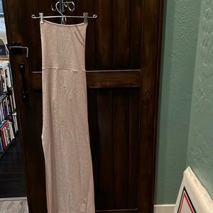 Thin evening gown shimmery pink with open low back.